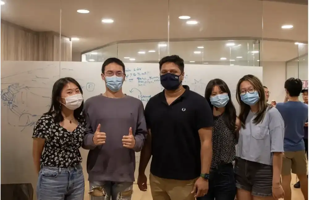 IB Math tutor Mr Ejaz with students at Photon Academy Singapore